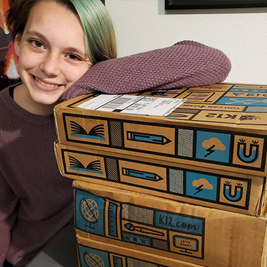 Student with boxes image