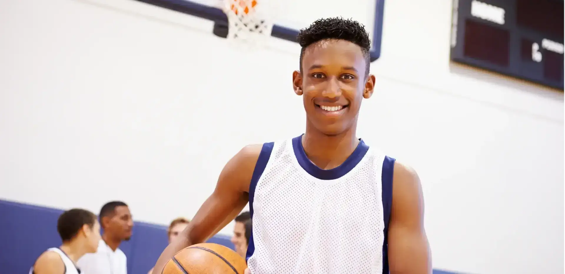 Student holding a basket ball