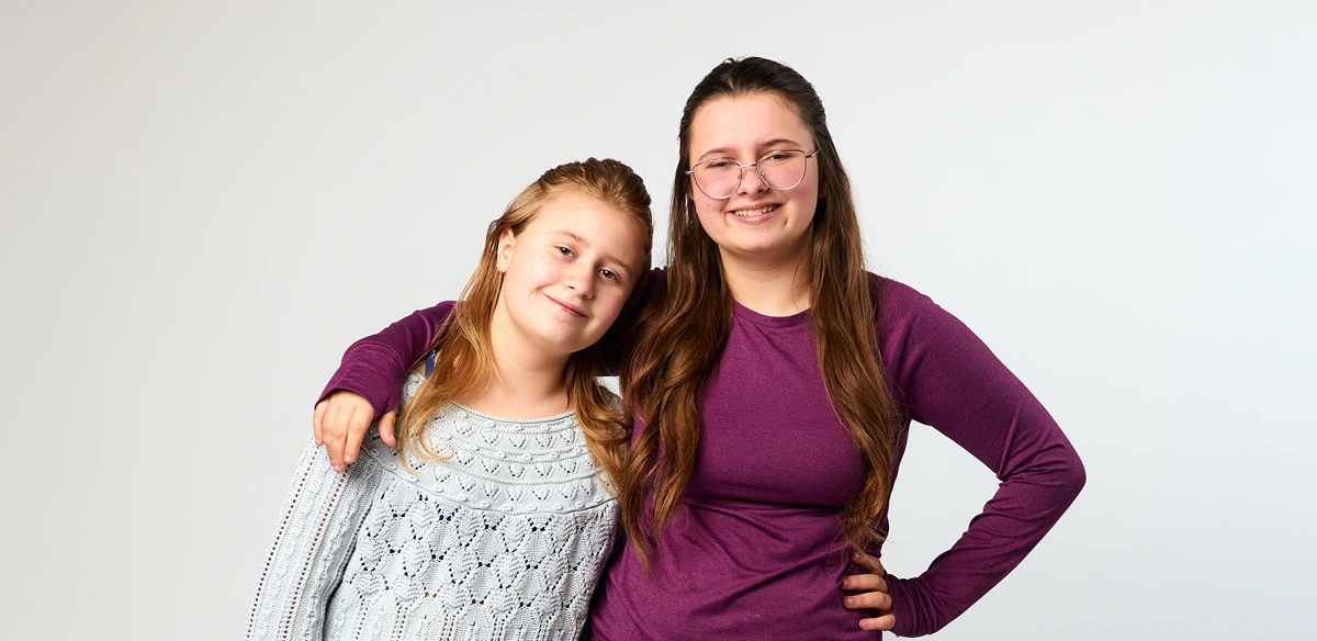 girls hugging each other