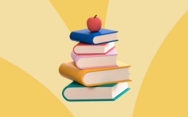 Stack of colorful books topped with a red apple against a blue background representing virtual learning and education.